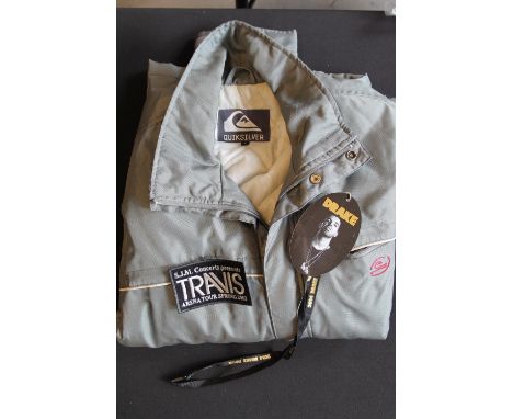 TRAVIS - A Travis Quicksilver jacket provide for the crew along with an unused sewn on patch TRAVIS, also included is a Drake