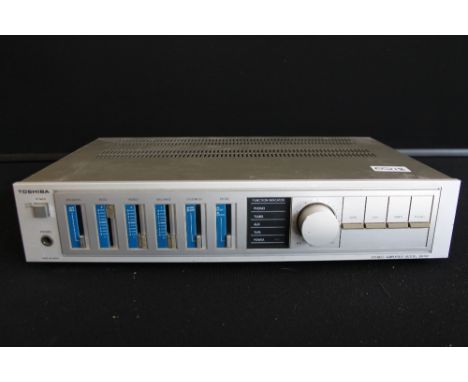 TOSHIBA - a Toshiba stereo amplifier model SB-M2 and UK mains plug.