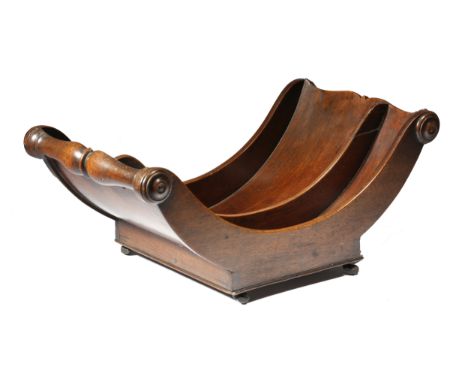 A Regency mahogany cheese coaster, with split baluster lifts with two divisions and applied with turned rondels, on leather r