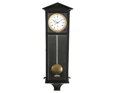 A small Vienna regulator style wall clock, the brass five day movement with an enamel dial with Roman numerals and signed 'S.