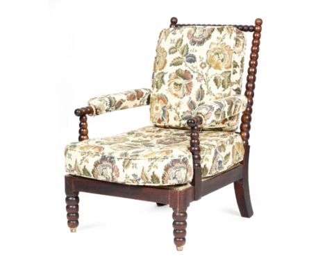 λ&nbsp;A George IV rosewood bobbin turned armchair in the manner of Gillows, originally on castors.