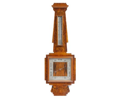 An Art Deco walnut barometer, with a silvered dial and thermometer, 81.4cm long. Provenance: The Collection of Sir Jeremy Lev