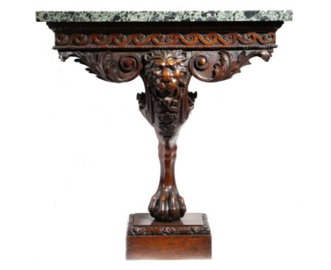 A pair of mahogany console tables in George II style, each with a verde antico marble top, above a leaf moulding and a Vitruv