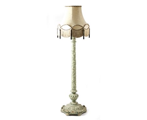 An Italian painted and carved wood standard lamp, with a leaf and scroll capital, above a stem entwined with a grapevine, on 