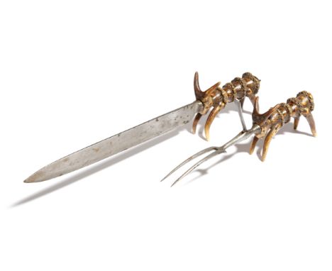 A Victorian steel and antler carving set, comprising: a knife and a fork, with a hinged guard, stamped 'DODCE SHEFFIELD', eac