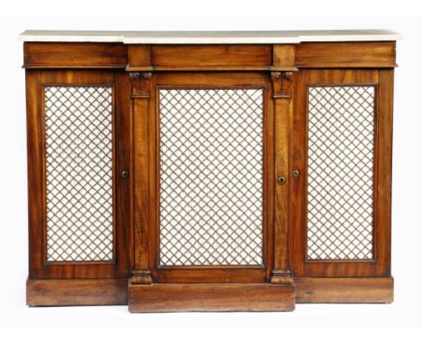 A George IV goncalo alves breakfront side cabinet, the later marble top above a plain frieze and a central gilt brass lattice