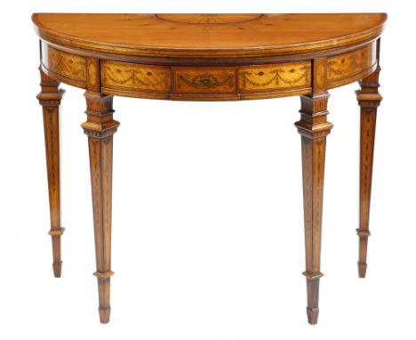 A late Victorian satinwood and marquetry demi-lune card table by Filmer, the crossbanded fold-over top inlaid with a fan and 