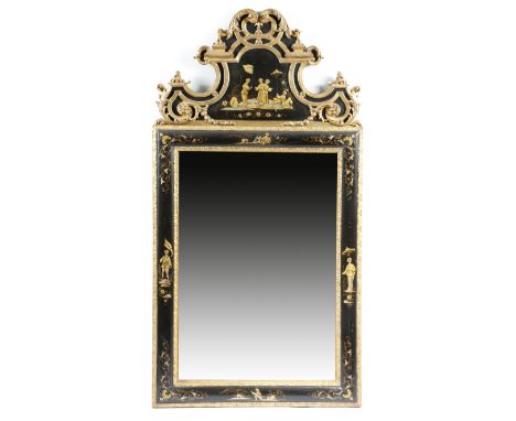 A black japanned and gilt wall mirror in early 18th century style, the rectangular plate within a carved leaf slip and a cush