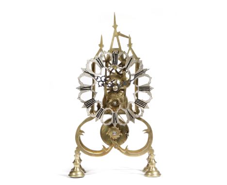 A Victorian brass skeleton clock, the single fusee movement with an anchor escapement, the silvered chapter ring with Roman n