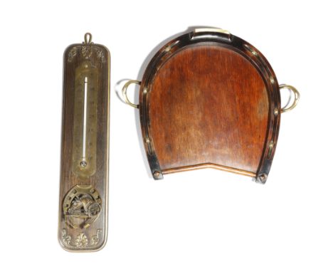 A late Victorian oak and fruitwood stirrup cup tray, in the form of a horseshoe, with brass stirrup handles, 39.7cm wide, tog