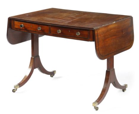 A Regency mahogany sofa table, inlaid with ebonised stringing, the drop-leaf top above a pair of cedar lined frieze drawers, 