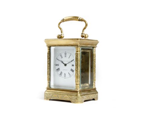 A French gilt brass miniature carriage clock, with a platform lever escapement, the enamel dial with Roman numerals and inscr