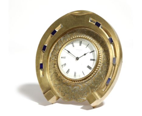 A novelty French brass clock, in the form of a horseshoe, the movement with a lever escapement and stamped 'V. A. P. BREVETE'