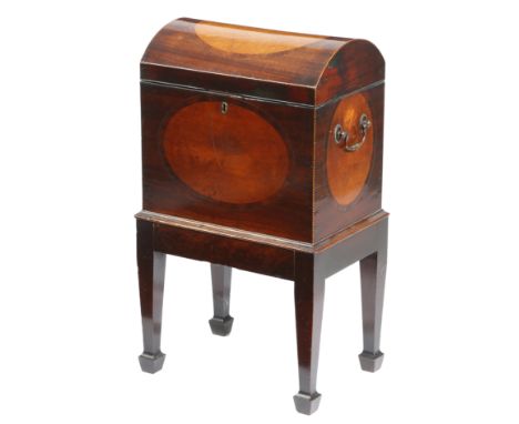 A George III mahogany teapoy, inlaid with barber's pole stringing and with satinwood oval panels, the domed hinged top reveal