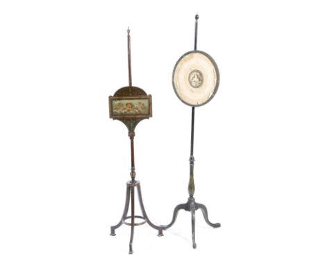 Two late George III painted pole firescreens, each with an adjustable panel, one painted with winged cherubs, the other with 
