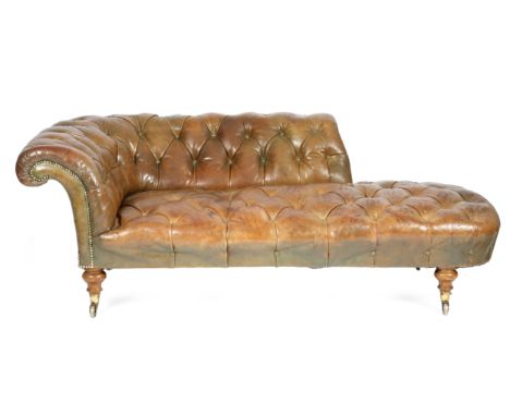 A Victorian day bed, later button upholstered with leather, on walnut supports and brass caps and castors, stamped 'COPE COLL