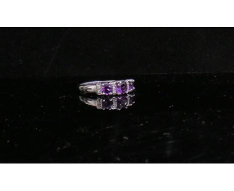 A 9ct white gold amethyst and diamond ring. Size P, 3g