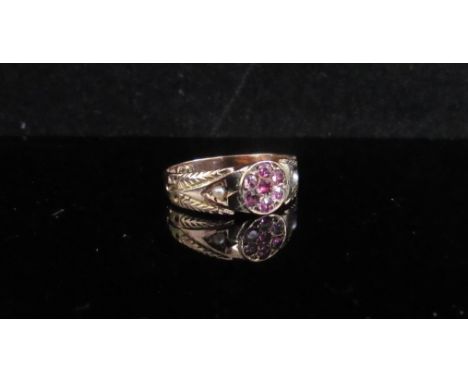 A 9ct gold seed pearl and pink stone ring, engraved shoulders. Size M, 1.8g