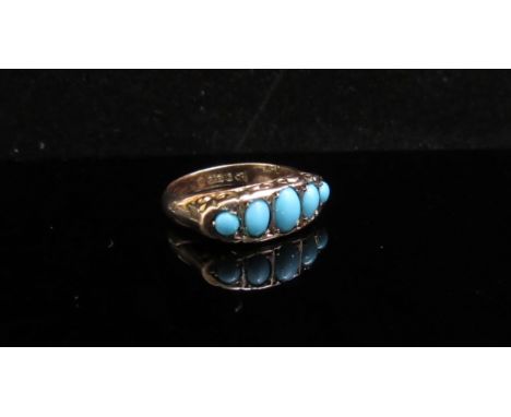 A 9ct gold five stone turquoise ring. Size K, 2.1g