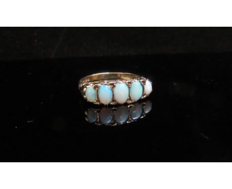 A 9ct gold five stone opal ring. Size M/N, 2.5g