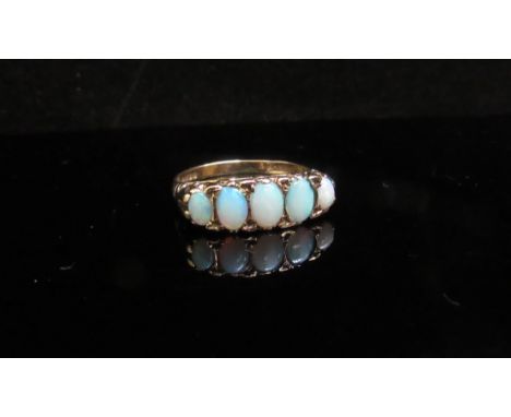 A 9ct gold five stone opal ring. Size M/N, 2.5g