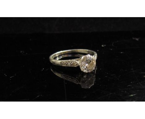 A white gold diamond solitaire ring .75ct diamond approx. with diamond set shoulders. Size L, 2g