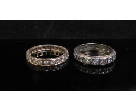 A 9ct gold eternity ring and a silver/9ct example, both set with paste stones, 4.6g