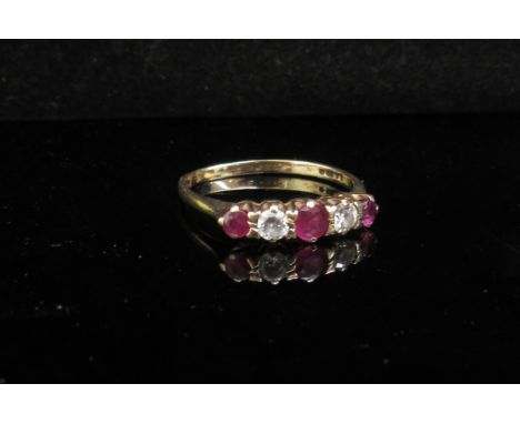 A 9ct gold ruby and clear stone ring a/f. Size N/O, 1.5g