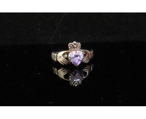 A 9ct gold Claddagh ring with pale amethyst stone. Size J, 2g