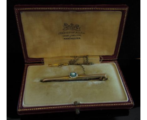 A gold bar brooch with enamel and pearl centre, stamped 9ct, 3.2g in fitted case