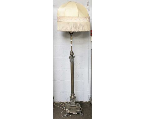 A Silvered Telescopic Standard Lamp of Corinthian columnar form with paw feetWhen fully extended the bulb holder is 206cm hig