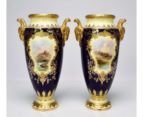 A pair of Coalport vases, circa 1900-10of tall, ovoid form, with twin rams head handles, the cobalt and lemon yellow ground w