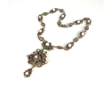 An Austro Hungarian pendant on chain, the white metal pendant set with untested pearls and faceted paste with enamel embellis