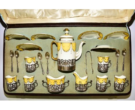 A Coalport cased silver mounted coffee service, hallmarked for Jay, Richard Attenborough Co Ltd, Chester, 1907in a yellow, wh