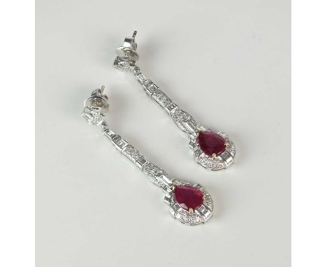 A pair of mid-20th century style ruby and diamond ear pendants, each designed as a single pear cut ruby claw set within a bor