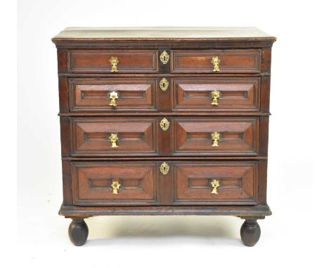 An oak geometric chest of drawers, circa 1700The moulded top above two short and three long mitre and raised moulded drawers,