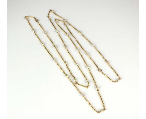 A yellow metal seed pearl set chain, the yellow metal wrythen links set throughout with single seed pearls, with two bolt rin