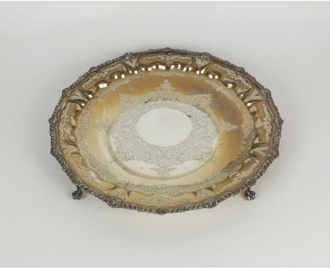 A Victorian silver salver, *R, Sheffield 1898, of ciruclar form with bright cut engraved decoration, gadroon and shell rim an
