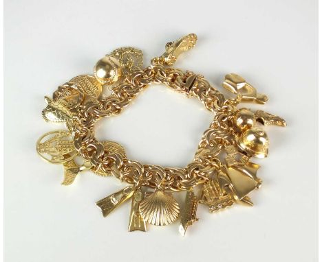A yellow metal double scroll link bracelet, with attached yellow metal and gold charms, to include; a policemans helmet, a sc