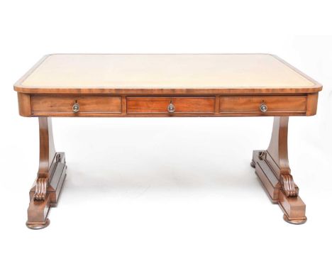 A Victorian mahogany library tableThe top inset with pale green tooled leather skiver, above six short opposing frieze drawer