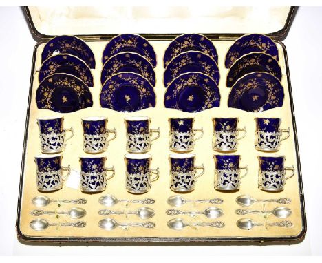 An impressive Coalport cased silver mounted coffee service, dark cobalt ground decorated with gilt foliage, a twelve-person s