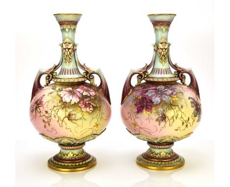 A pair of Royal Worcester prismatic enamel vases, circa 1890, of twin-handled form with satyr masks to the neck, painted with
