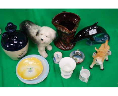 A collection of porcelain to include a dog , a Toby jug and a Poole pottery dolphin. H17cm

Cost to post within the uk is £15