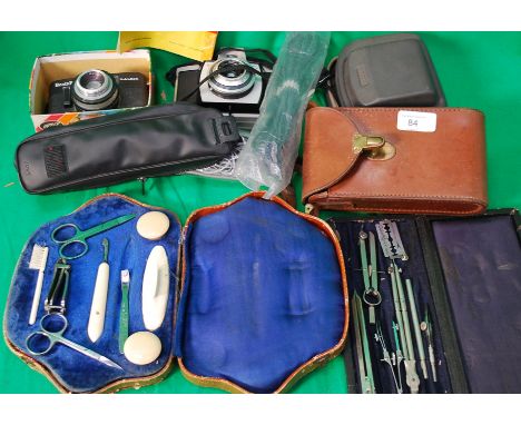 Two vintage cameras along with a draughtmans set and a nail set .

Cost to post within the uk is £15.99+ VAT on a tracked and