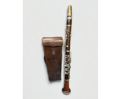 Douglas &amp; Co Late 19th Century Clarinet, in a brown leather case. Generally excellent condition.
