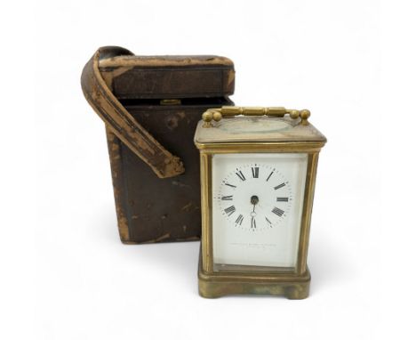 19th century Gilt Brass Carriage Clock, the white enamel face marked Webster &amp; Co in leather travelling case. Face damage