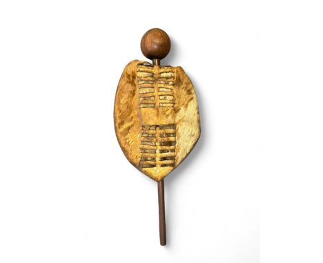 African hide shield and knobkerrie. Leather to reverse, shield measures 32cm x 24cm, knobkerrie measures 59cm.