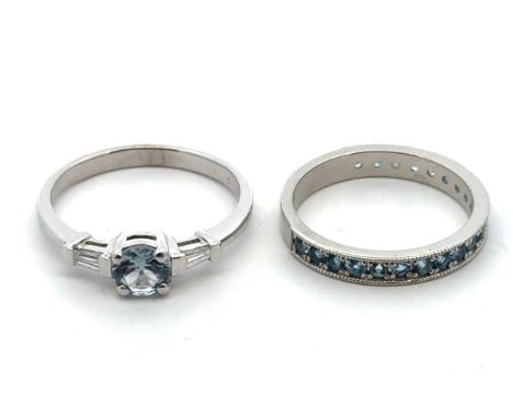 Two platinum and topaz rings. A three quarters eternity ring, set with 21 topazes. Size L, Birmingham hallmarks, sponsor SH. 