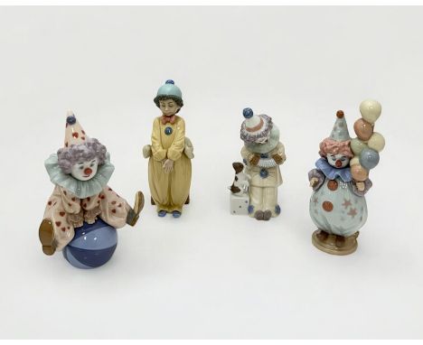 Lladro, a group of four Lladro clown figures , to include; Having a Ball (5813), Pierrot with Concertina (5279), Pierrot in L
