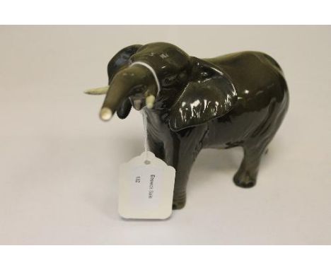 A Beswick Figure : Elephant - Trunk Stretching, Small, model 974, gloss, height 12.1 cm. 